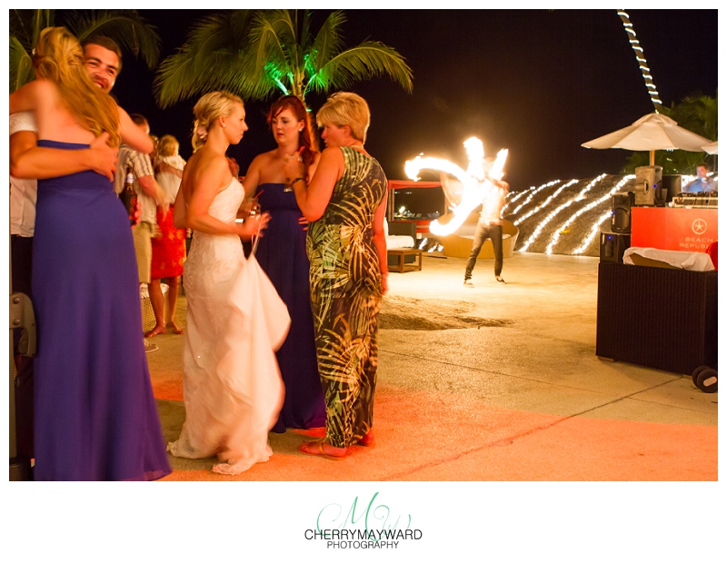 Koh Samui Wedding, fire dancer, guests talking and interacting during fireshow, Beach Republic, Wedding in Thailand 