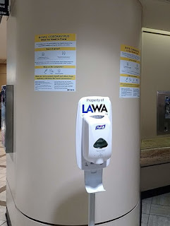 https://commons.wikimedia.org/wiki/File:Hand_sanitizer_and_signs_at_Los_Angeles_International_Airport.jpg