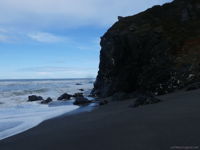 end of the line, waves washing the rocks