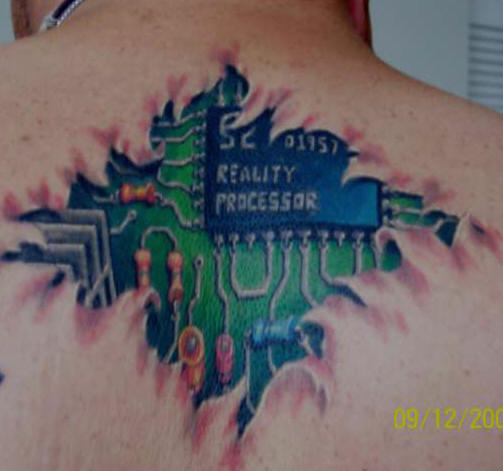 Computer chip upper back tattoo