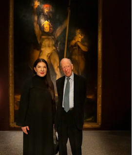 L. Marina Abramović poses with Jacob Rothschild in front of 'Satan summoning his Legions', 1796-1797