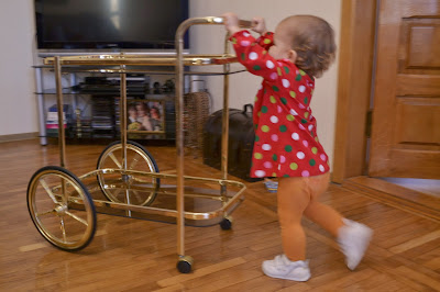 a small girl is playing with table in the living-room