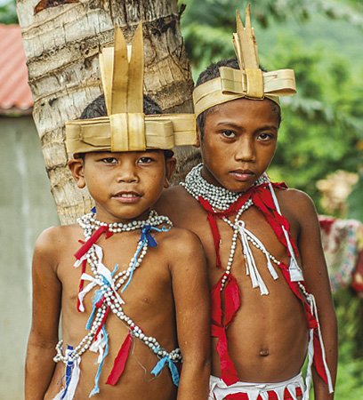 Casiguran Agta children sporting rattan headdresses known as biskal