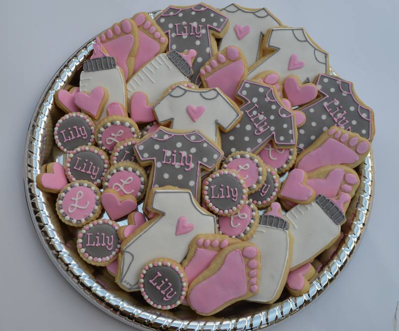 pink and grey baby shower cookies for a soon to be born little girl