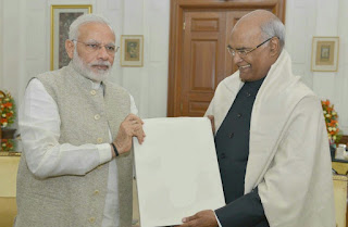 MODI PRESIDENT KOVIND WITH A DOCUMENT