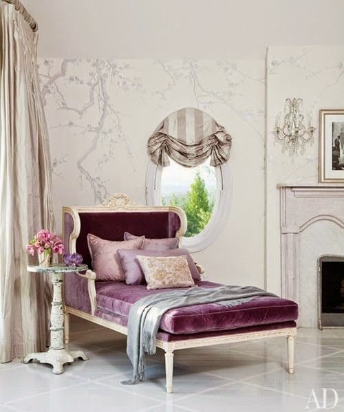 purple velvet chaise white tile floor gray tree branch mural living room design