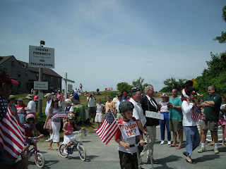Spectators and bike riders in annual Quisset, MA July 4th parade
