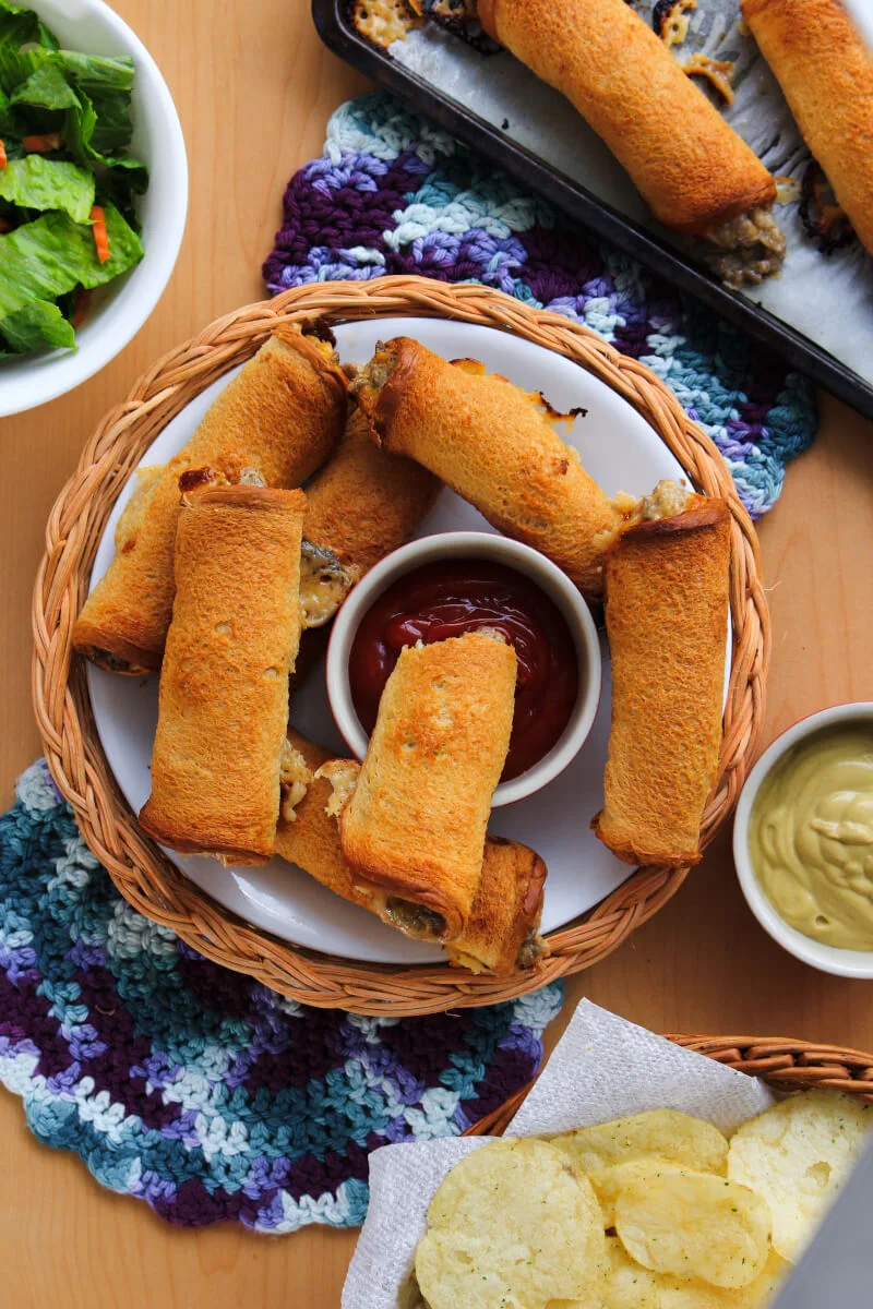 Cheeseburger Roll-Ups put a fun spin on burger night. They will make the whole family happy with their crisp, buttery outside and delicious cheeseburger filling! #groundbeefrecipes #easydinner