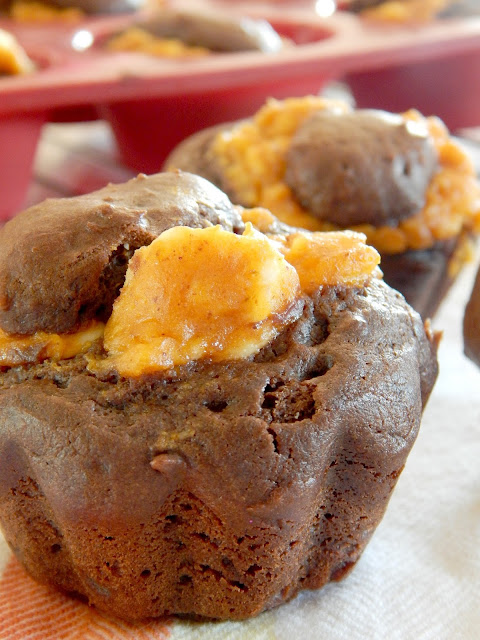 Pumpkin Cheesecake Mocha Muffins...the perfect sweet bit with your morning coffee!  Rich, deep chocolate with a creamy pumpkin filling, studded with coffee flavor! (sweetandsavoryfood.com)