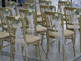 Wedding Chairs Decorated with ribbons and flowers