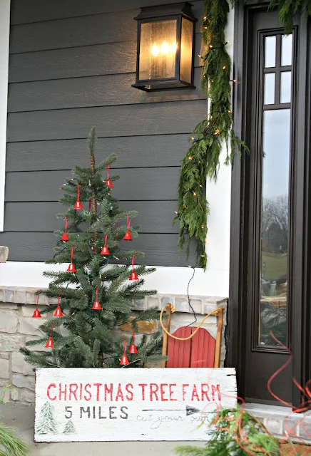 Christmas porch with tree and sign