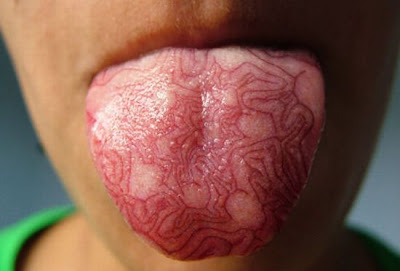 tribal tongue tattoed