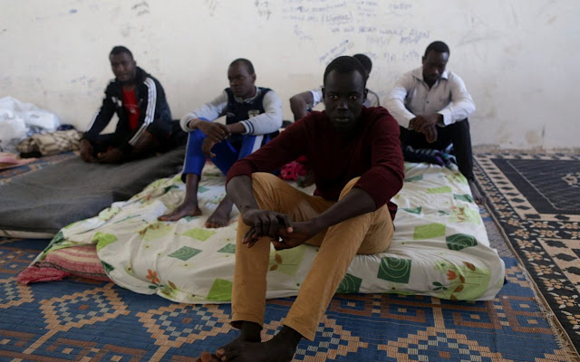3 people at a migrant resident in Italy identified by fellow migrants as people who tortured them in a detention centre in Libya