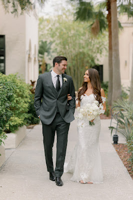 bride and groom smiling and walking