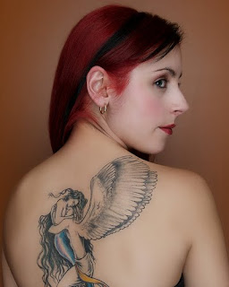 angel tattoo on a woman's body