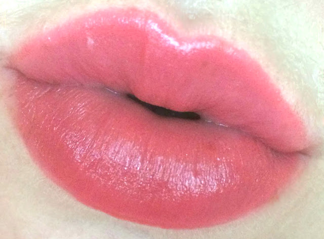 Too Faced Lip Injection Color Bomb! in Coral Pop! on lips