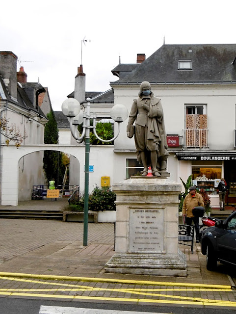 Statue of Descartes in his birth town, masked during Covid19 lockdown. Indre et Loire. France. Photo by Loire Valley Time Travel.