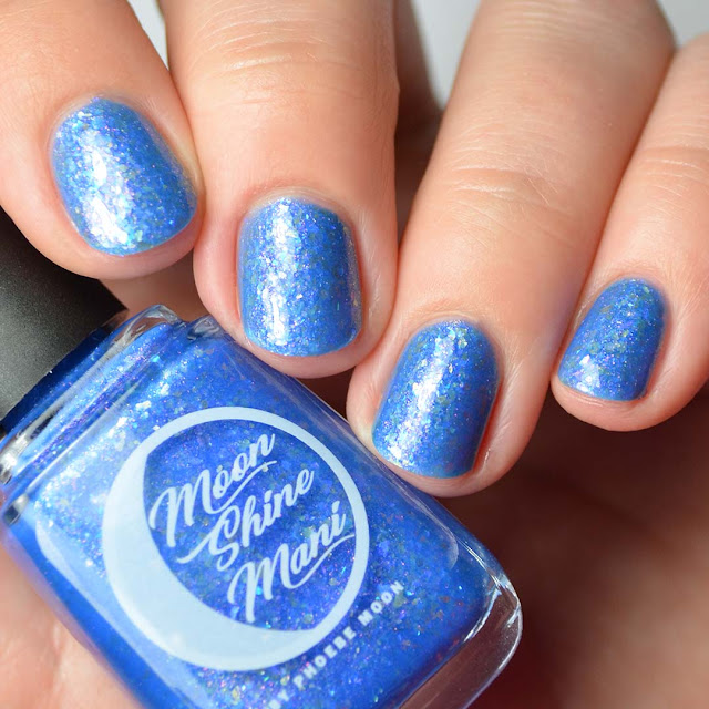 blue nail polish with flakies and shimmer