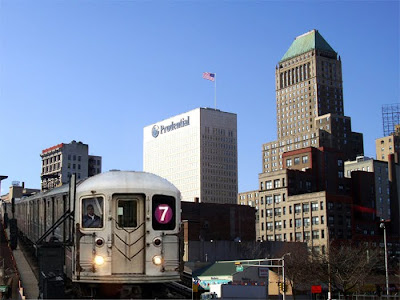 New York City's 7 train with the Newark skyline in the background