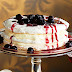 Triple-layered vanilla pavlova with cherry sauce Recipe