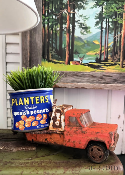 Rustic truck with vintage tin and faux plant.