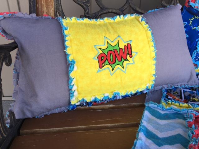 Superhero themed throw pillow with Pow embroidery