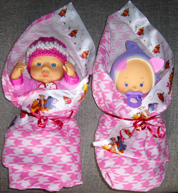 Baby dolls with hats and blankets crafted for Operation Christmas Child shoe box packing.