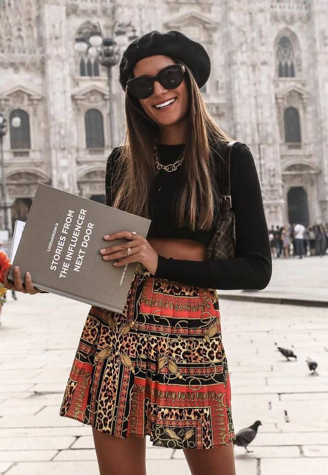 how to wear a black beret : printed skirt + bag + black crop top