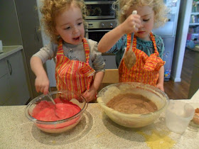 Adding pink colouring and cocoa to mix for Rainbow Cake. Adding pink colouring and cocoa to mix for Rainbow Cake.