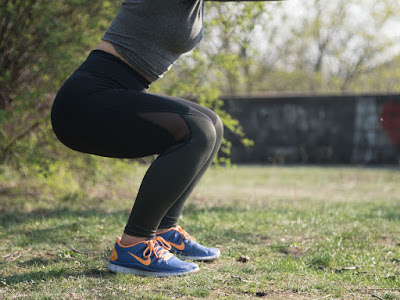 a woman doing squat workout.