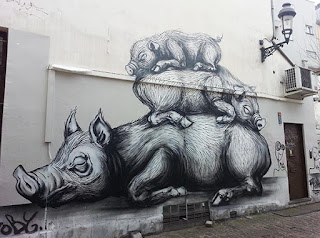 Graffiti urban street art wild boar family theme by Roa