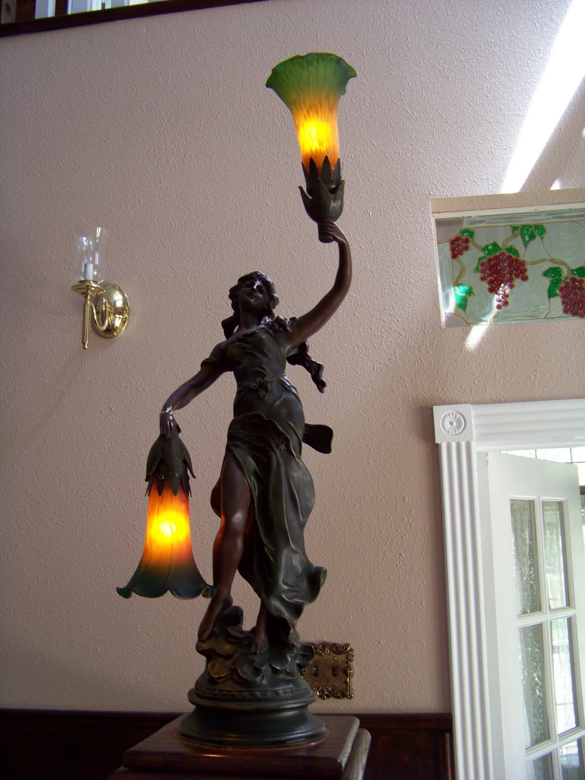 This little girl, with her lighted tulips, is guarding the bottom of 