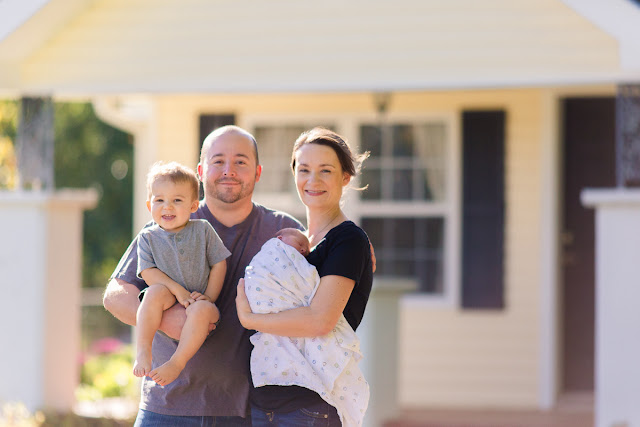 Taken in front of their home in Shawnee, OK, the family gathers for their first photo shoot after becoming a family of four.