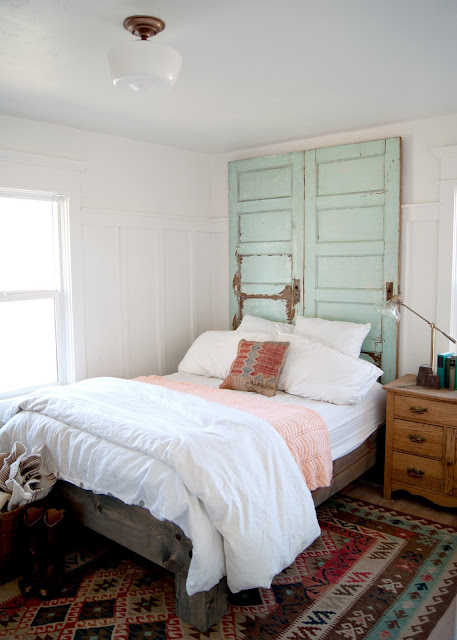 Farmhouse Master Bedroom Reveal - Benjamin Moore Simply White, antique wash stand, glass shade pharmacy lamp, crosby lamp, target , door headboard, kilim rug