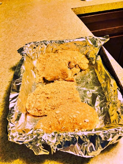 Place breaded chicken into foil lined pan