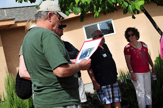 Guests looking at a picture and passing it around