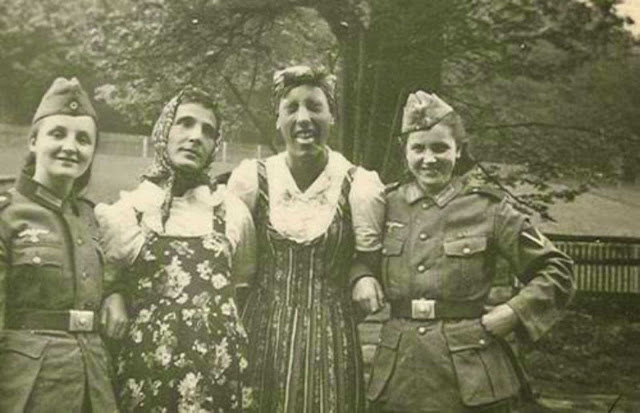 German soldiers exchanging their clothes with their girlfriends. Those uniforms really fit those women pretty well! 