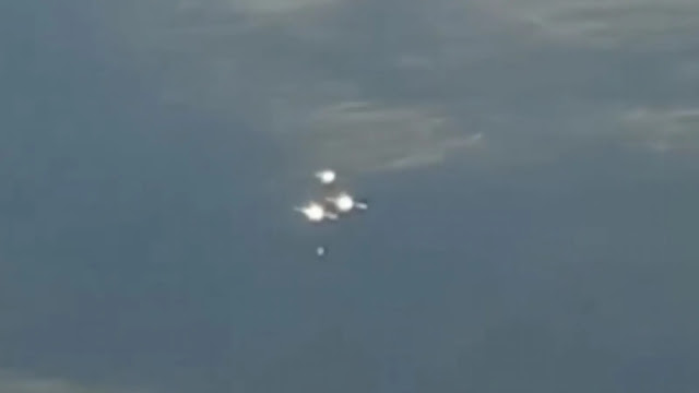 4 UFO craft's that just appeared from nowhere near an airplane then vanished.