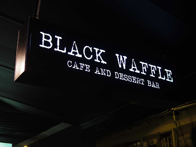 Black waffle cafe sign