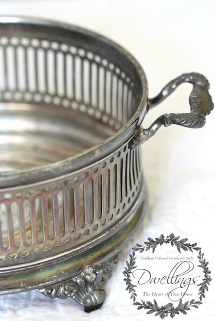 Silver serving dish turned candle holder.