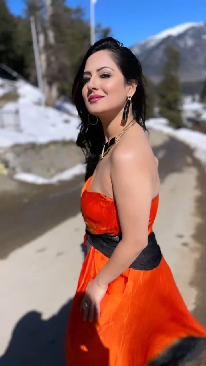 Puja Banerjee cleavage orange dress