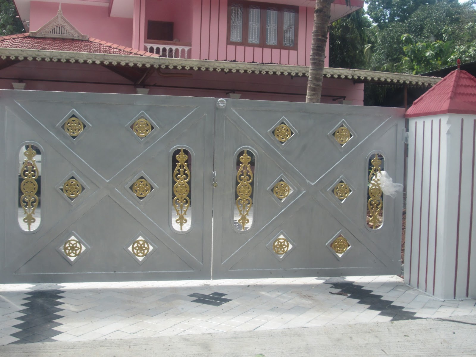 Kerala Gate Designs Silver colour gate with goden works