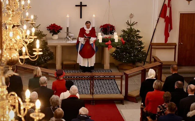 Queen Margrethe wore a red wool jacket and burgundy midi dress. The Queen wore her Order of the Garter