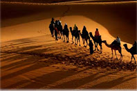 <Img src="caravana-de-camellos-noche-Mohammed.jpg" width = "389" height "258" border = "0" alt = "Caravana de camellos.">