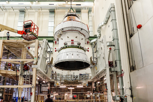 Inside the Operations and Checkout (O&C) Building at NASA's Kennedy Space Center in Florida, the Orion capsule for Artemis 2 is about to be transferred to the O&C's west altitude chamber to undergo electromagnetic interference and compatibility testing.