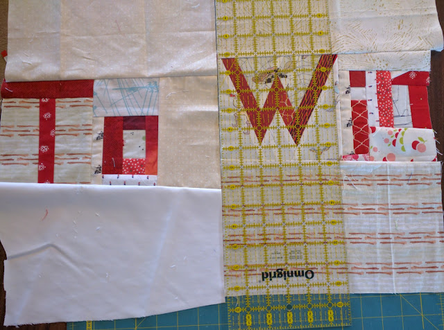 Use rulers to space the pieced-fabric words.