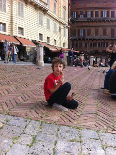 Eating a gelato in Piazza Il Campo, Siena, Tuscany, Italy