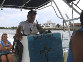 Rosi and Ariel on the boat as we pass 'the white house' at Sac Bajo on Isla Mujeres