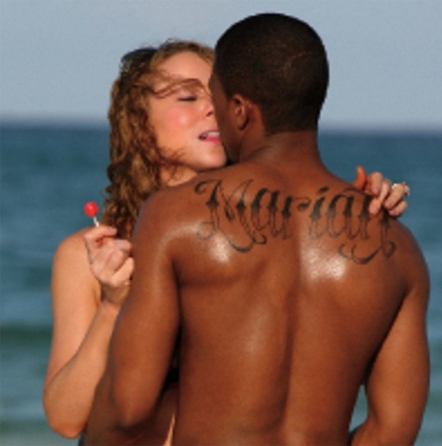 Last name tattoos on back.