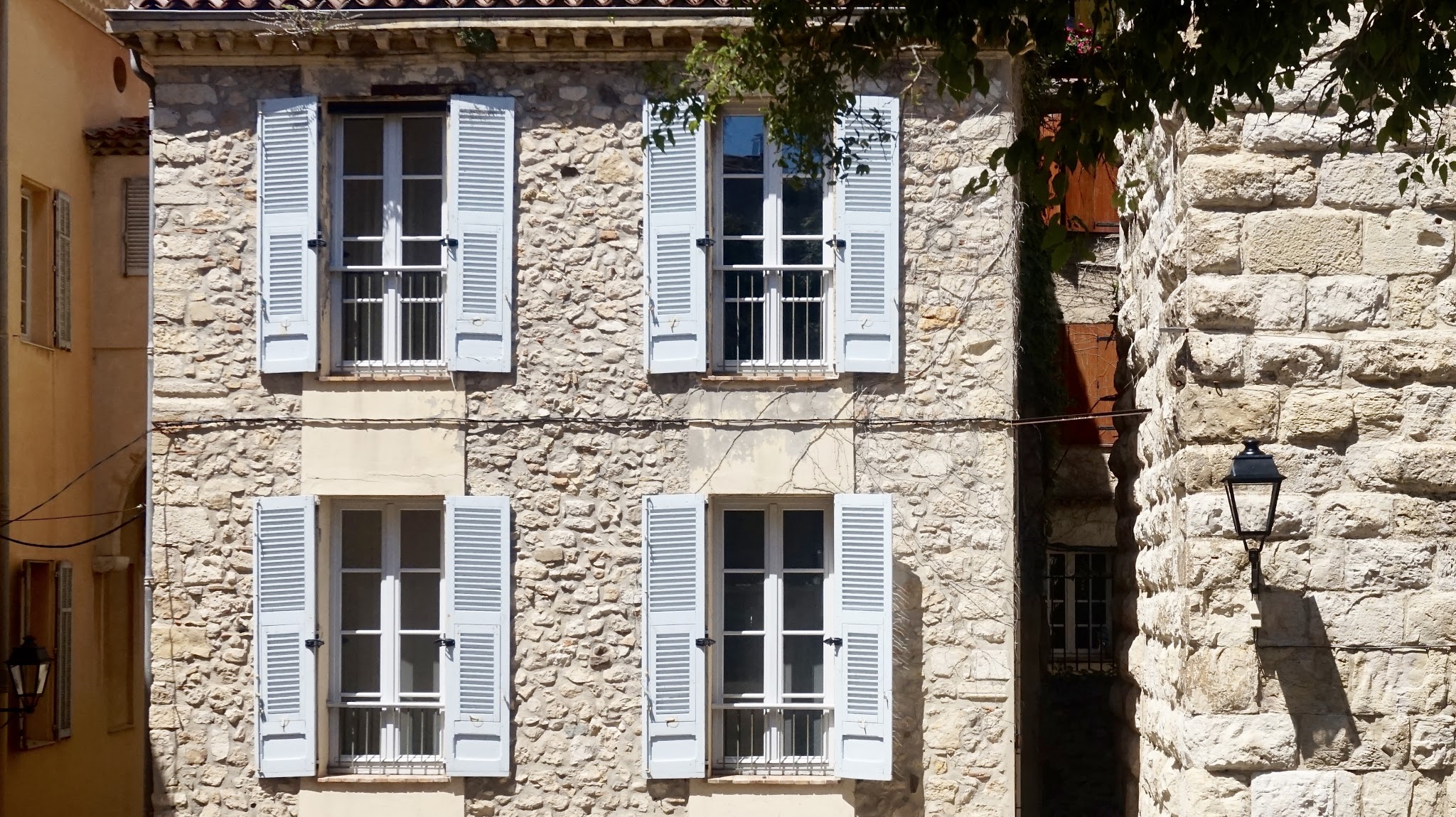 pale blue window sashes on a French cottage